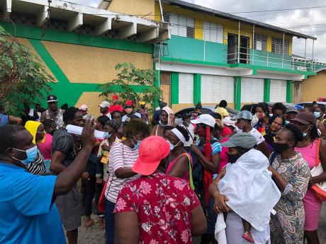 Scores of New Haven residents were turned away from a relief initiative yesterday as the crowd grew causing difficulties in enforcing COVID-19 protocols.