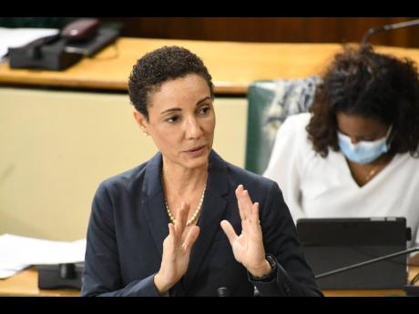 Kamina Johnson Smith, minister of foreign affairs and foreign trade, debating the Electricity (Electrical Work, Registration and Licensing) Regulations, 2020, in Gordon House yesterday. 