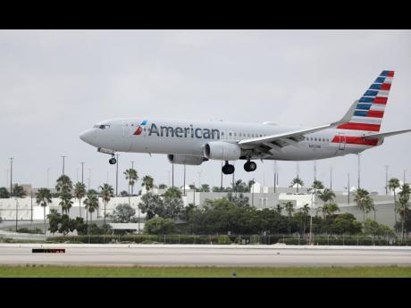 An American Airlines Boeing 737-823 lands at Miami International Airport on Monday, July 27, 2020.