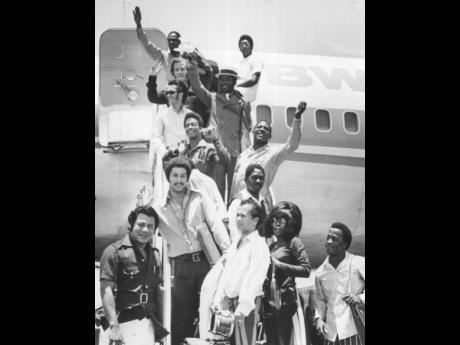 OFF ON TOUR: Byron Lee (front row, left) and members of the Dragonaires are seen at the Palisadoes Airport before they left the island for their North American tour in this 1971 file photograph. 
