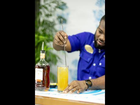 JWN Academy trained mixologist Randeen Thomas gently stirs a Stormy Valley cocktail to perfection at Appleton Estate’s Home is Where is the Rum is mixology session.
