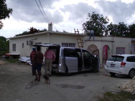 The house in Chantilly Gardens, in Westmoreland, where Daniel Porter reportedly shot his girlfriend and best friend before killing himself yesterday.