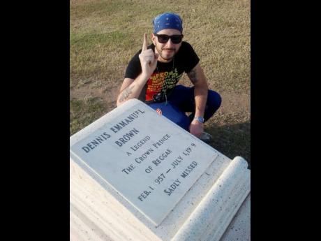 The vinyl collector and re-presser visited the grave of Dennis Brown during a stop at the National Heroes Park. 