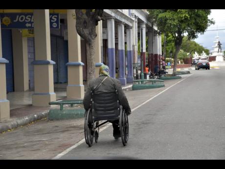 A man in a wheelchair makes his way up King Street in downtown Kingston. Most Caribbean countries have had a negative evolution in the HDI ranking over the past decade or so. Jamaica, for example, has fallen 23 places while Dominica has fallen by 10.