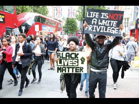 The Black Lives Matter protesters march in central London in solidarity with their US counterparts.  