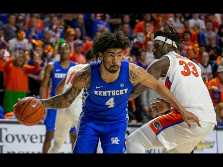 Forward Nick Richards drives to the basket during the second half of an NCAA college game between Kentucky and Florida in Gainesville, Florida, on Saturday, March 7.