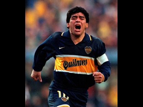 FILE 
In this Oct 25, 1997 file photo, Diego Armando Maradona celebrates a goal on his last official soccer game with Boca Juniors in Buenos Aires, Argentina. The Argentine soccer great, who was among the best players ever, and who led his country to the 1