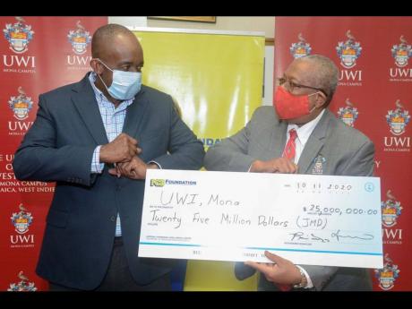 President and chief executive officer, National Commercial Bank Financial Group, Patrick Hylton, hands over a cheque valued at $25 million to Principal of UWI, Mona, Dale Webber, highlighting the continued support for education via the Gratitude Fund. In 2