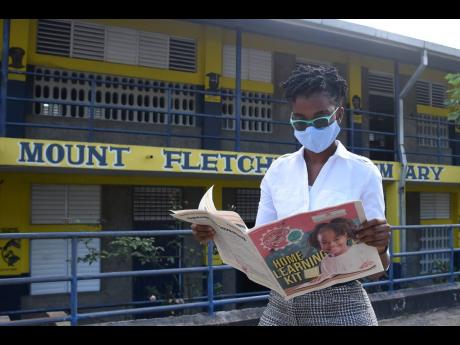 Fifth-grade teacher at Mount Fletcher Primary School, Nyla Louza, is overjoyed after receiving learning kits from the Ministry of Education, Youth, and Information on Wednesday. 