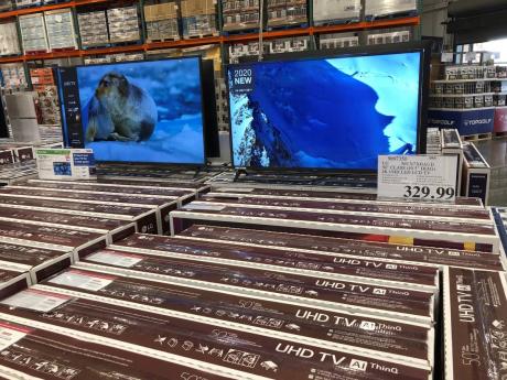 Rows of boxed big-screen televisions sit on display at a Costco warehouse in this photograph taken on Wednesday, November 18, in Sheridan, Colorado.
