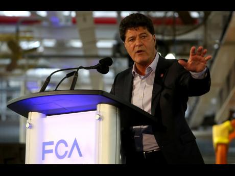 AP PHOTOS
Jerry Dias, Unifor National president, talks on stage at the FCA Windsor Assembly Plant on May 6, 2016 in Windsor, Ontario Canada. Unifor members have voted overwhelmingly in favour of a new three-year contract with Fiat Chrysler Automobiles.