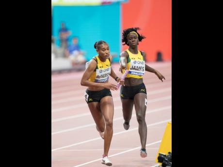 Tiffany James hands the baton to Stephenie-Ann McPherson during the women’s 4x400m relay at the 2019 IAAF World Athletic Championships held at the Khalifa International Stadium in Doha, Qatar, on Sunday, October 6, 2019. The team that finished third in t