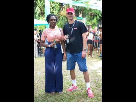 Jodi Hylton, brand manager, beers, the HEINEKEN Company and Director for Zimi Entertainment Nicholas ‘Zimi Nick’ Mahfood beat the heat with ice cold beers at a 2019 staging of Zimi Seh Brunch. 