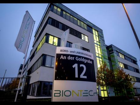 AP
In this Tuesday, November 10, 2020 file photo, windows are illuminated at the headquarters of the German biotechnology company BioNTech in Mainz, Germany.