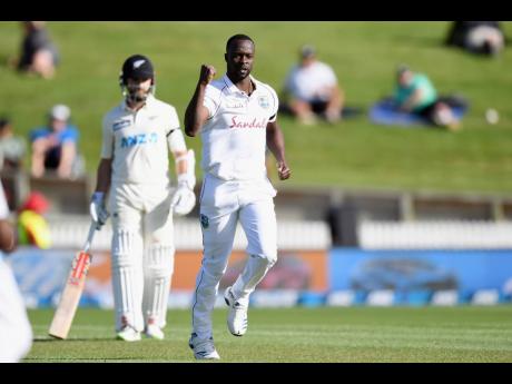 West Indies pacer Kemar Roach celebrates taking a wicket against hosts New Zealand during their first Test match, being played Siddon Park Oval in Hamilton.
