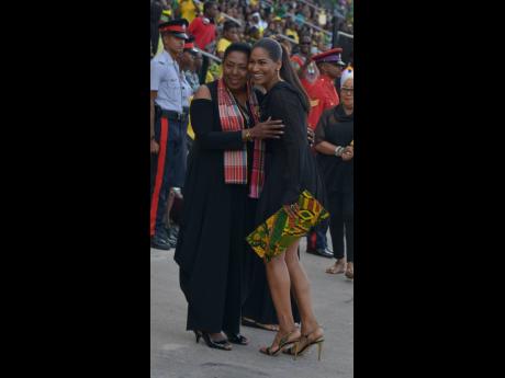 
Culture Minister Olivia Grange (left) greets then opposition foreign affairs and foreign trade spokesperson, Lisa Hanna, at the 2018 Grand Gala at the National Stadium. The audit report said that there was no record the JCDC recovered the overpaid amount 