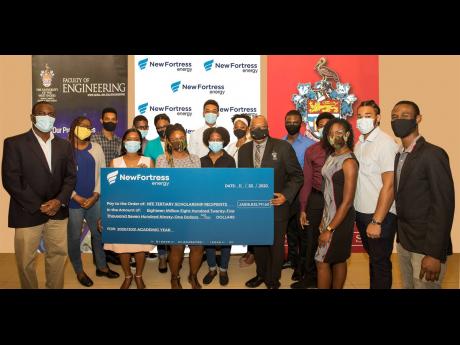 Engineering students at the UWI collect their scholarships from New Fortress Energy Foundation. In the photo with the students are Adrian Lawrence (left), dean of the Faculty of Engineering;  Jacqui Burrell Clarke (centre), director of communications and c
