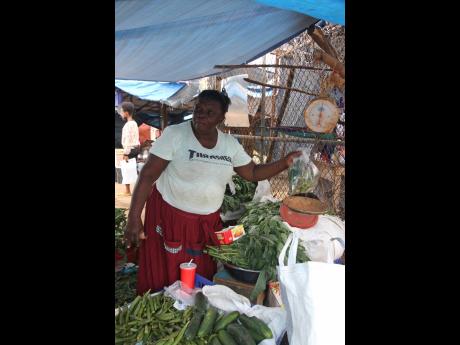Icilda Grant reflects on what has been a challenging year since she lost all her merchandise in a blaze at the May Pen Market in Clarendon a year ago.