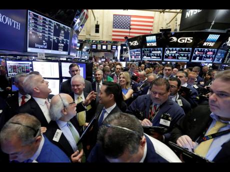 AP 
New York Stock Exchange, NYSE,  floor governor Rudy Maas (left) calls out prices during the IPO of MGM Growth Properties on the floor of the NYSE on Wednesday, April 20, 2016. Wall Street has rolled out the welcome mat for companies going public this y