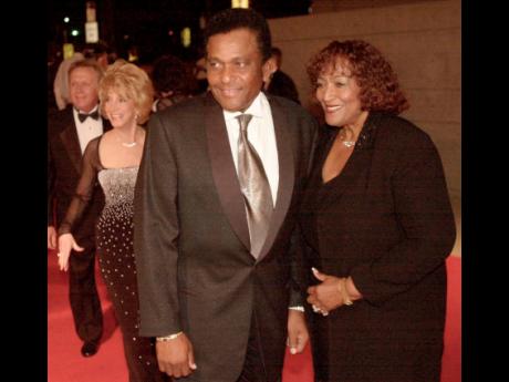 In this October 26, 2000 file photo, Country music legend Charley Pride and his wife Rozene arrive at the Gaylord Entertainment Center. Pride, who became one of country music’s biggest stars and the first black member of the Country Music Hall of Fame, d