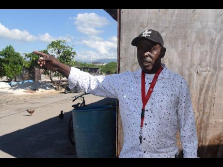 Right: Winston Monroe, chairman of the Greenwich Town Fisherfolk Benevolent Society in Kingston, says there won’t be many smiles around the village for Christmas.