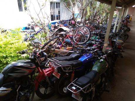 Some of the motorcycles which have been seized and impounded at a section of the Savanna-la-Mar Police Station in Westmoreland. This is just a small number, as they are stored all over the station compound.
