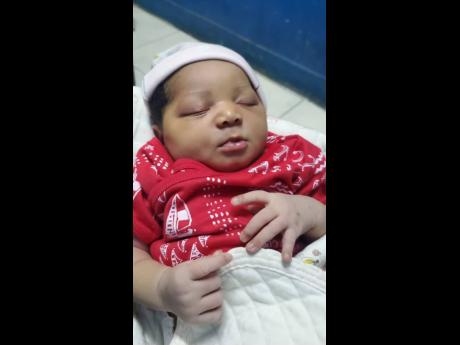 The newborn baby found by vendors and others in a shopping arcade in downtown Kingston. The police are appealing for persons to help in finding the parents.