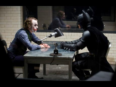 Actors Heath Ledger (left) and Christian Bale in a scene from the 2008 film ‘The Dark Knight’. The film was added to the National Film Registry. 