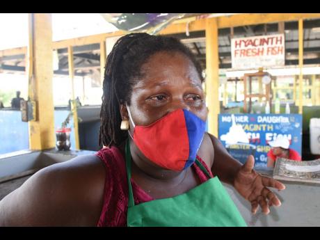 Candace Samuels, a fish vendor at the Jamworld Fishing Village in Portmore, St Catherine, recalls the tragic events that left her common-law husband Dwyer Robinson paralysed.