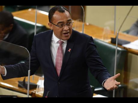 Minister of Health and Wellness Dr Christopher Tufton addressing Parliament on Tuesday, December 8. He has taken flak over his claim that local contractors renovating Cornwall Regional Hospital lack experience.