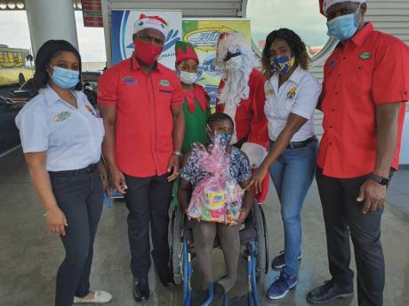 Theresa Oliphant (left), Inspire to Change Foundation member, and Sanmerna Paper Products Managing Director Robert White (second left) pose along with ‘Santa Claus’ and Stephanie Josephs, director, Inspire to Change Foundation, and fellow Sanmerna Dire