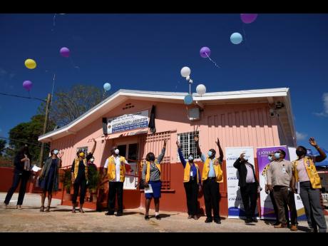 Participants in the launch of the Histopathology Laboratory at the Mandeville Regional Hospital release balloons at Thursday’s launch.