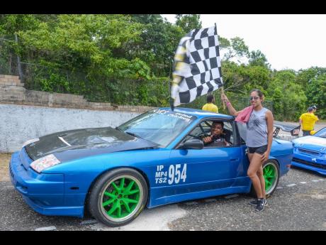 
Catherine Chok is one proud wife after hubby Kevin took the checkered flag at a past Dover racemeet.