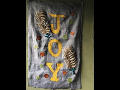 One of the 16 banners draped across the town of Oracabessa in St Mary, inspiring the residents with the Christmas spirit.