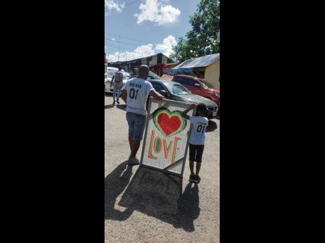 A father and son depicting love for the town of Oracabessa in St Mary.