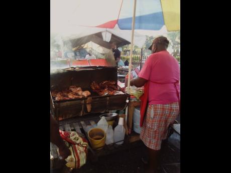 Lloyd Vincent has been selling jerk chicken for 10 years at Linstead Grand Market.