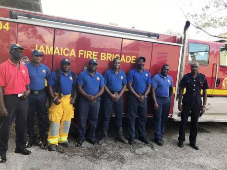 The team of firefighters who saved Brenda Isaac’s Highland House home recently.
