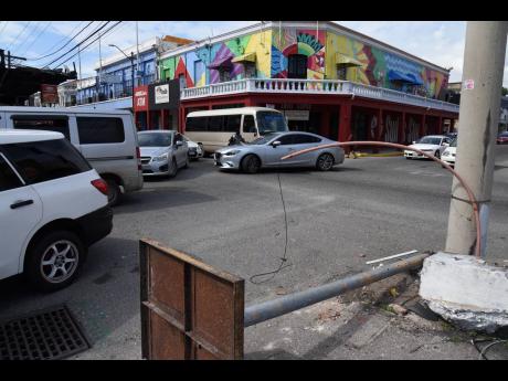 Snarls beset the intersection of Church and Harbour streets in downtown Kingston last Wednesday because of a downed traffic light. The National Works Agency (NWA) has reported that it will cost just above $1.5 million to repair the traffic signals, which w