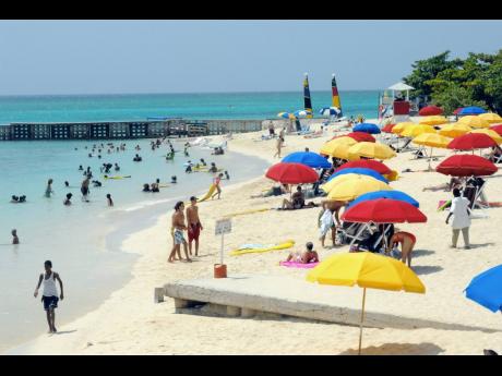 
Visitors enjoying the Doctor’s Cave Beach in Montego Bay, St James. Arrivals and earnings continue to be affected this year by the coronavirus pandemic. A new variant of the coronavirus has dampened optimism for a bounce in the winter tourism season.