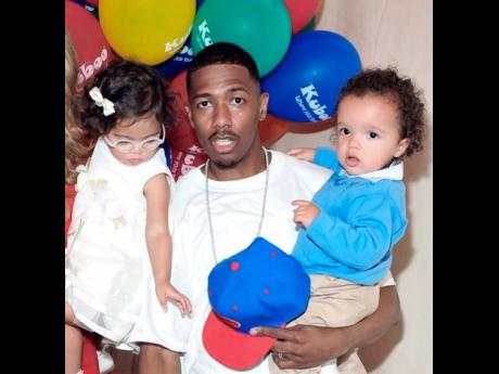 Nick Cannon poses with twins Monroe and Moroccan who he shares with ex-wife, Mariah Carey. His longtime girlfriend, Brittany Bell, has just given birth to his fourth child, a daughter named Powerful Queen Cannon.
