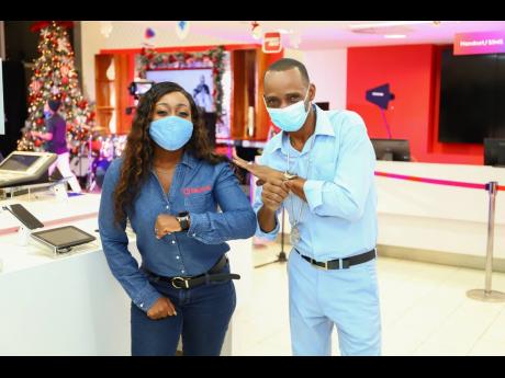 Sanchez opted for a cool blue outfit that matched his smooth performance. Here, he knocks elbows with Digicel Brand Marketing Manager Reshima Kelly.