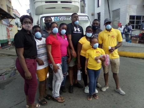 The team of police and other good Samaritans who brought Christmas Day cheer to the needy in Spanish Town.