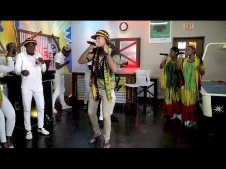 Christopher Elliott, general manager of Beaches Negril, performs with his team. 