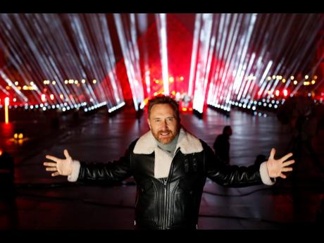 French DJ David Guetta poses for photographers in the courtyard of the Louvre museum in Paris on Tuesday.