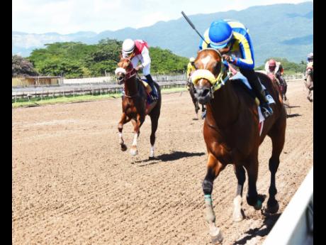 TRICKY ONE (on the rails), ridden by Oshane Nugent, wins the PICK3 Simple Ting Fi Win Trophy at Caymanas Park on Sunday, November 29, 2020. 