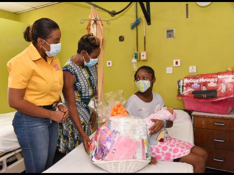 Top left: Camaila Johnson was happy for her New Year baby, Laiya Fearon. Minister of State in the Ministry of Health and Wellness, Juliet Cuthbert-Flynn (centre), and corporate programmes manager, LASCO Distributors Limited, Renee Rose, presented Johnson w