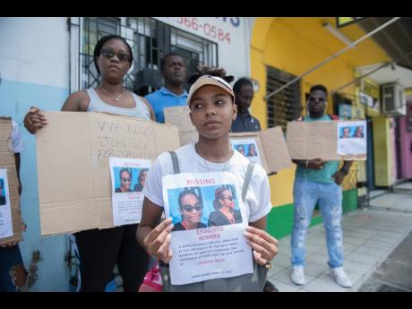 Ashae Deen, sister of the missing Jasmine Deen, protests with family and friends in Nine Miles, Bull Bay, on Sunday, July 19, 2020.