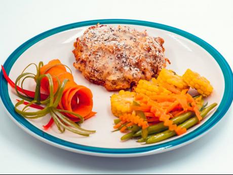 Nella’s sweet potato pasta bake surprise is served with fresh steamed and raw vegetables.