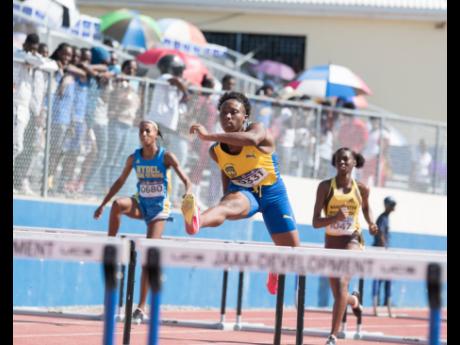 Clarendon College’s Marissa Simpson (centre) leads Heat One of the Class Two Girls’ 100m hurdles event at the Purewater/Jamaica College/R. Danny Williams Track Meet at Ashenheim Stadium at Jamaica College in St Andrew on Saturday, January 4, 2020.