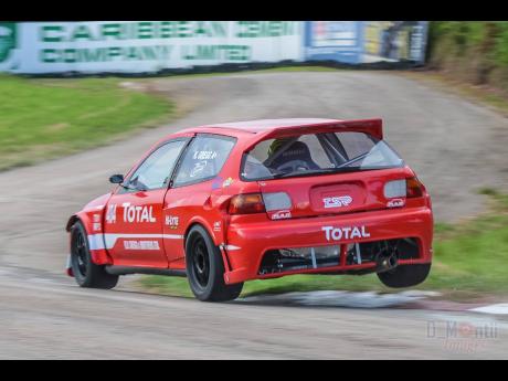Kyle Gregg puts his Honda Civic up on two wheels, as he navigates the tricky Dover Chicane.